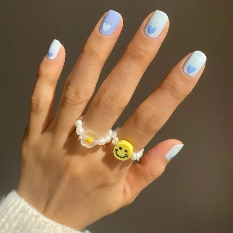 13. Shades of Blue Heart Nails