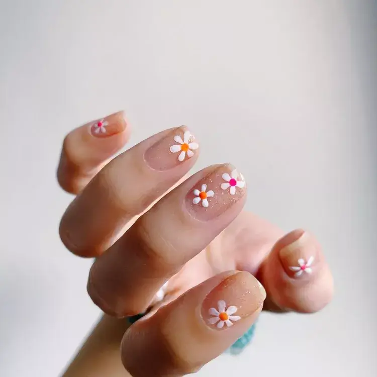 14. Pink and Orange Daisy Nails