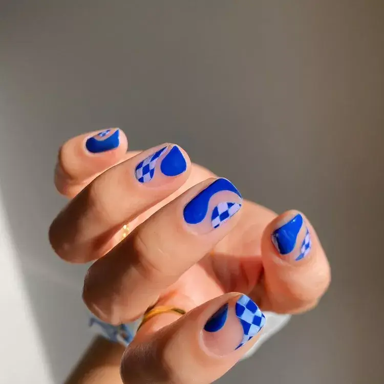 22. Negative Space Blue Check Wave Mani