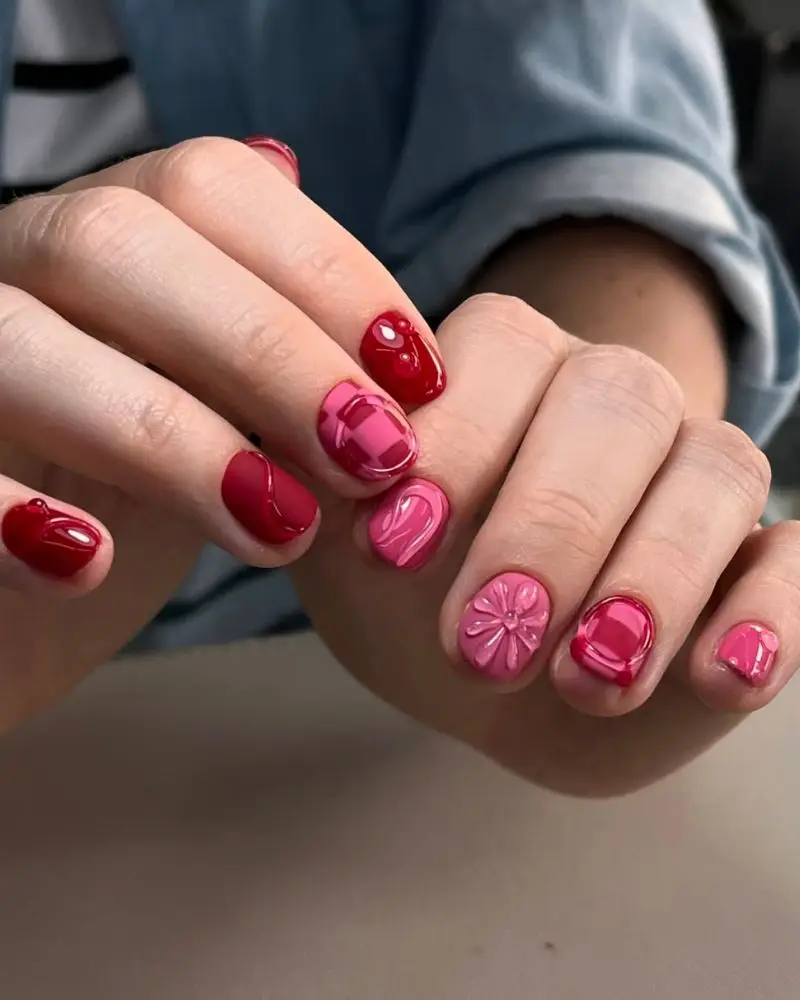 11. 3D nail art on red and pink base