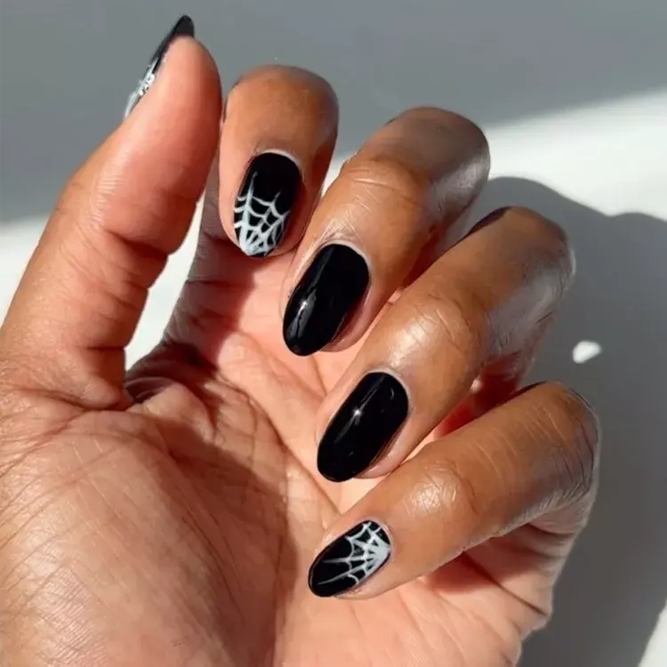 13. Jet-Black Spiderweb Nails