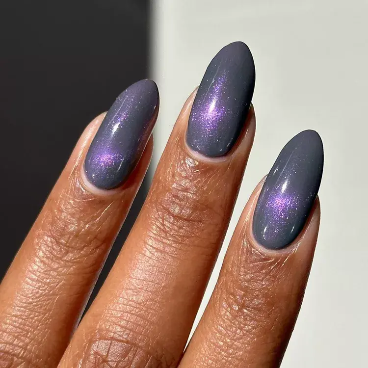 21. Purple Galaxy Cat-Eye Nails