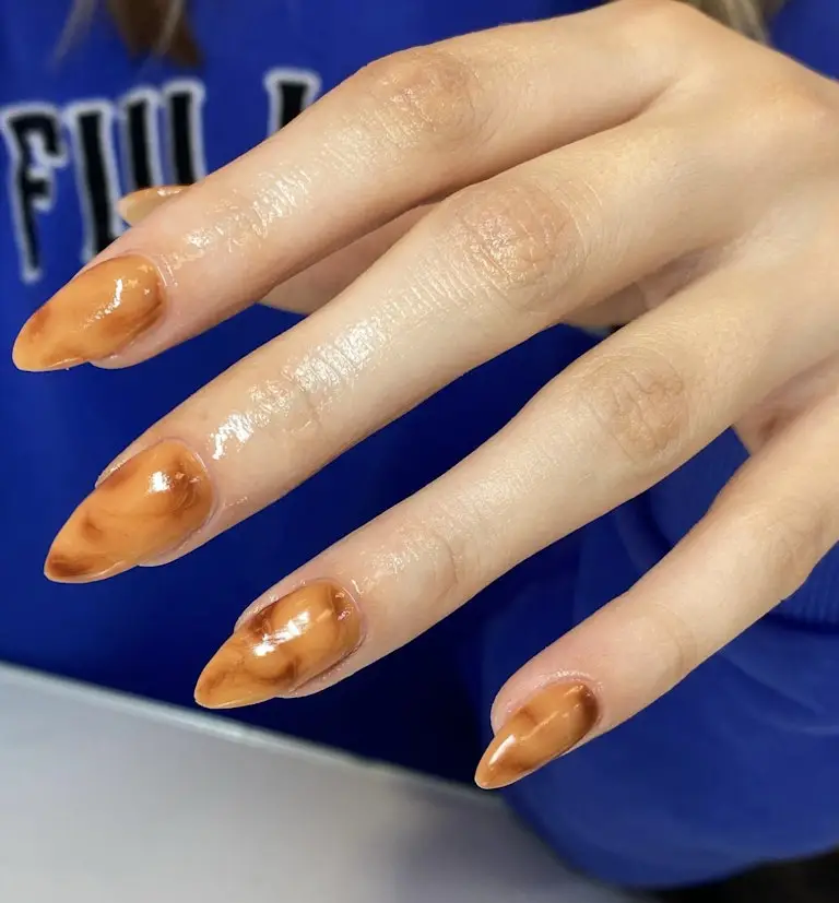 24. Tortoise Shell Acrylic Nails
