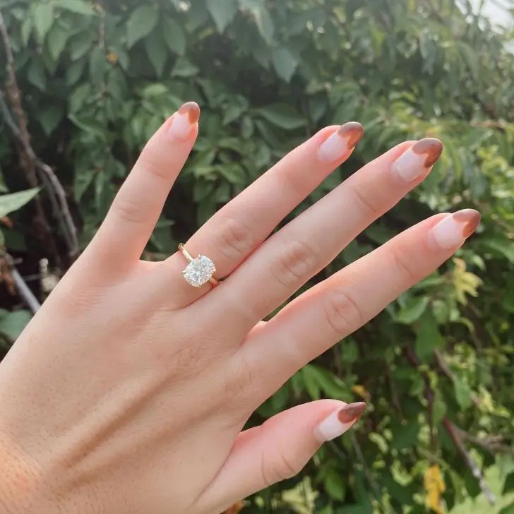 28. Heart-Shaped French Tip Fall Nail Design