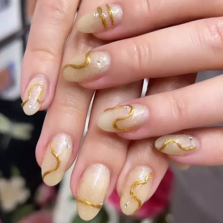 3. 3D Gold Swirl Nails