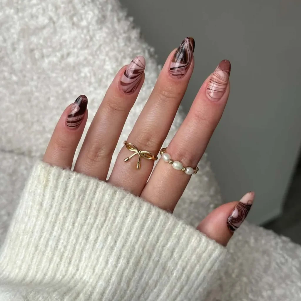 3. Brown Marble Swirl Nail Inspo