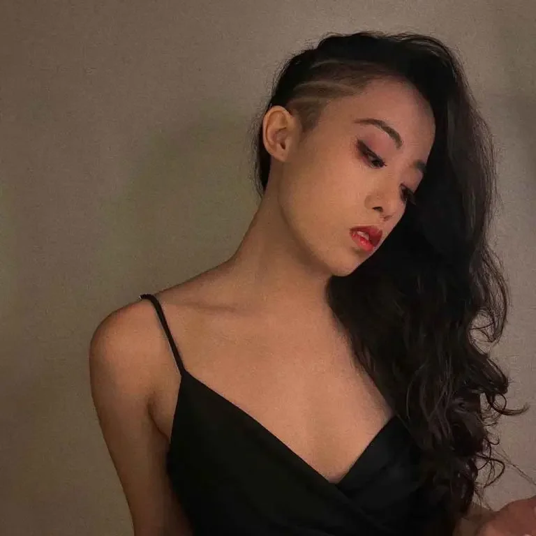 Long Wavy Side-Shaved Hairstyle With Clean Lines