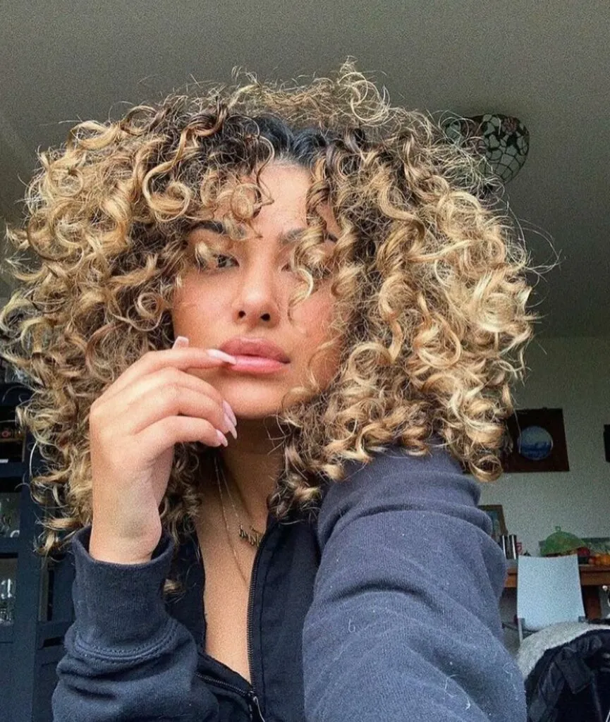 Butterfly Cut On Curly Dirty Blonde Hair