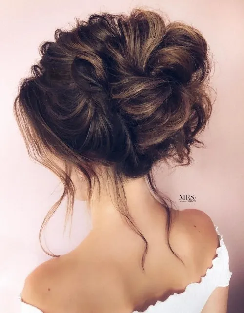 Textured High Bun with Loose Curls