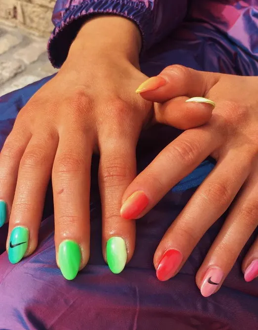 Neon ombre nails with Nike nail art details