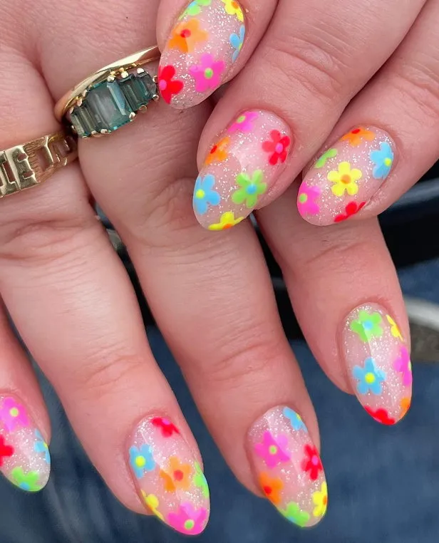 Silver sparkle nails with multicoloured neon flowers