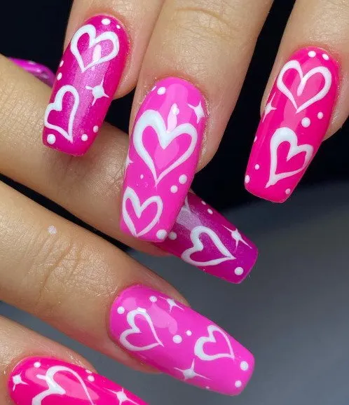 Valentineâs hot pink nails with white hearts